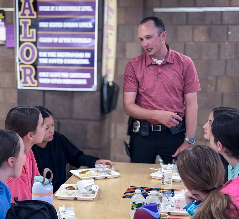  Detective Ryan Olson talks to students